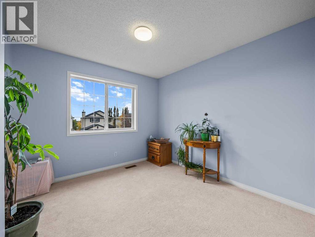 104 Rocky Ridge Heath Nw, Calgary, Alberta  T3G 4Z8 - Photo 18 - A2261861