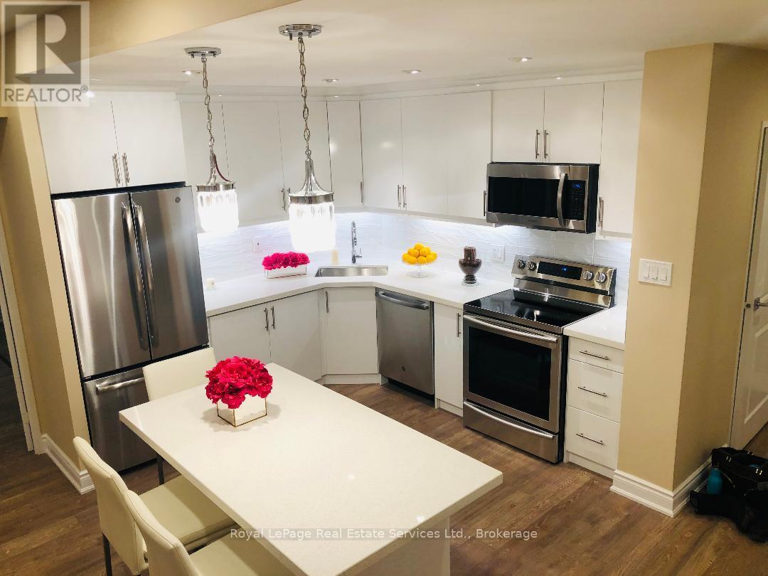 105 - 2185 Marine Drive, Oakville, Ontario L6L 5L6 - Photo 2 - W12566934