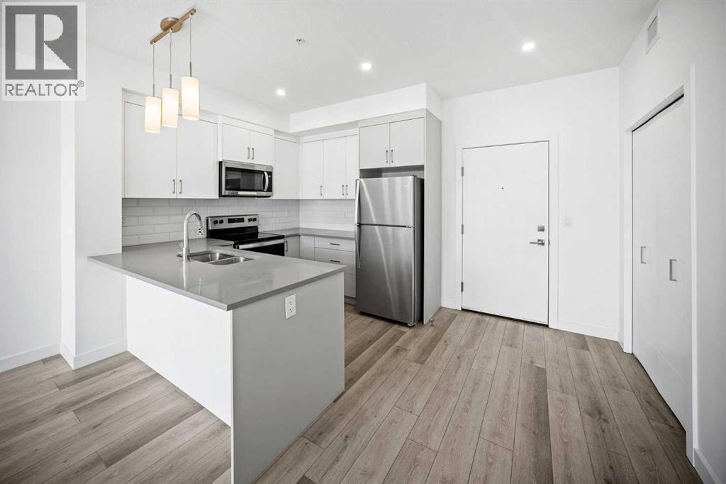 403, 205 Spring Creek Common Sw, Calgary, Alberta  T3H 6H4 - Photo 4 - A2260338