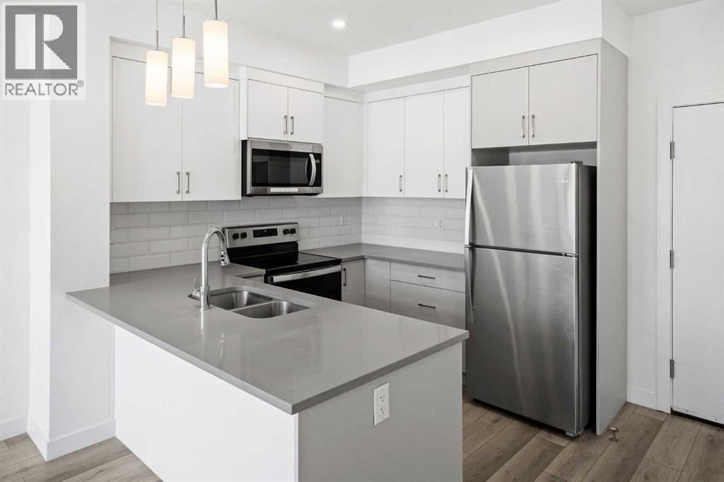 403, 205 Spring Creek Common Sw, Calgary, Alberta  T3H 6H4 - Photo 5 - A2260338