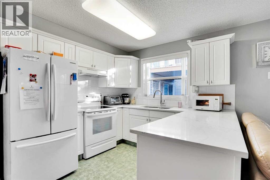 216, 6800 Hunterview Drive Nw, Calgary, Alberta  T2K 6K5 - Photo 4 - A2268404