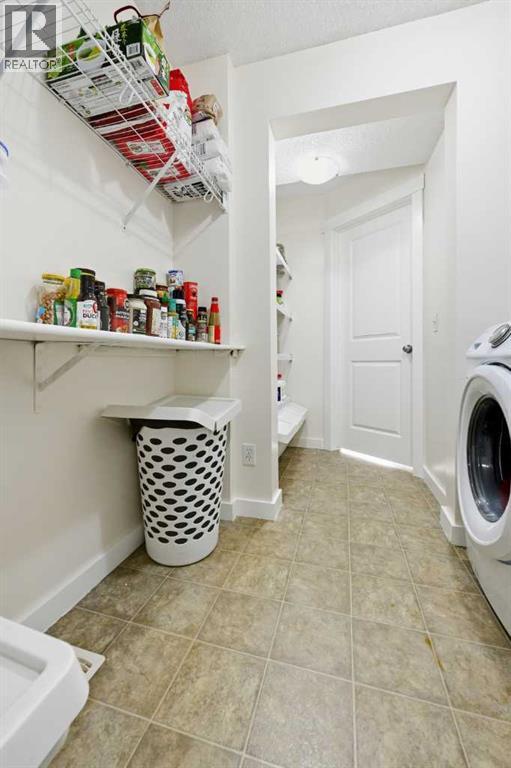 217 Coopers Grove Sw, Airdrie, Alberta  T2B 0G4 - Photo 26 - A2267001