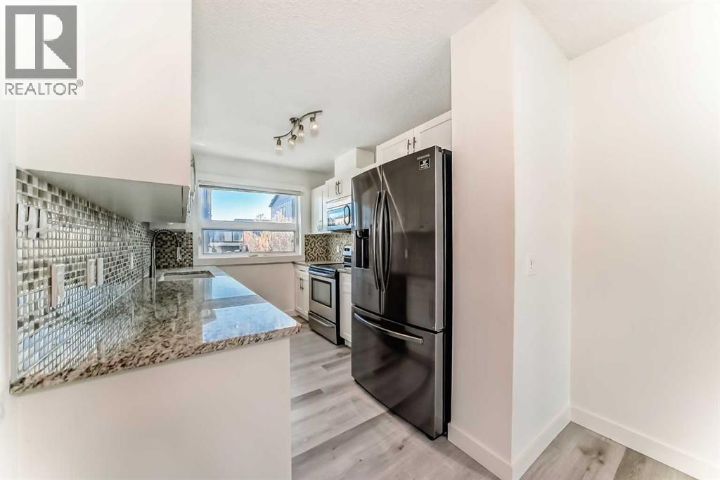 418 Covecreek Circle Ne, Calgary, Alberta  T3K 0W6 - Photo 5 - A2267603