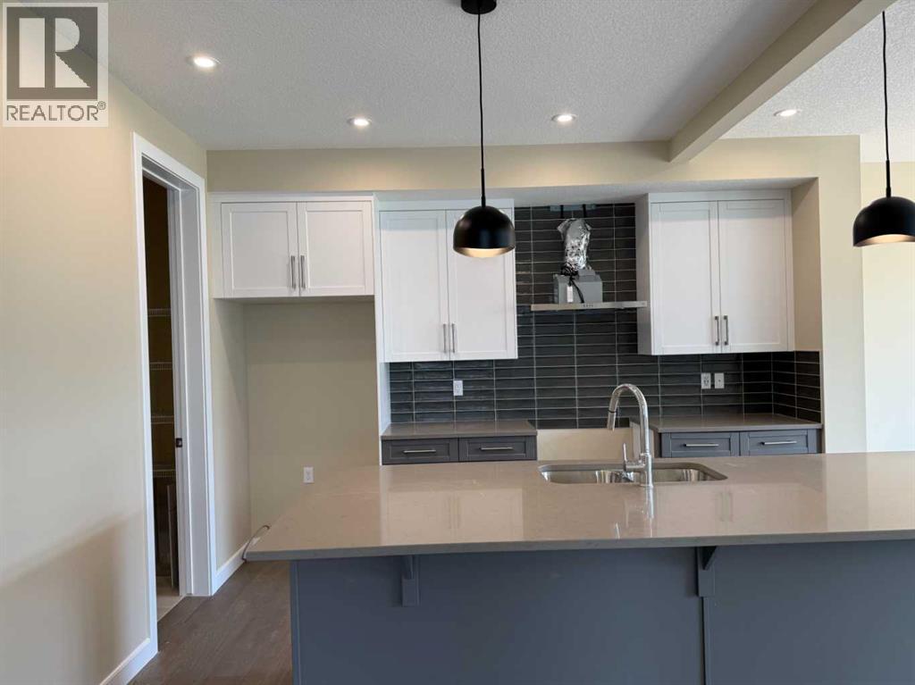 91 Sundown Crescent, Cochrane, Alberta  T4C 1Y3 - Photo 8 - A2228402