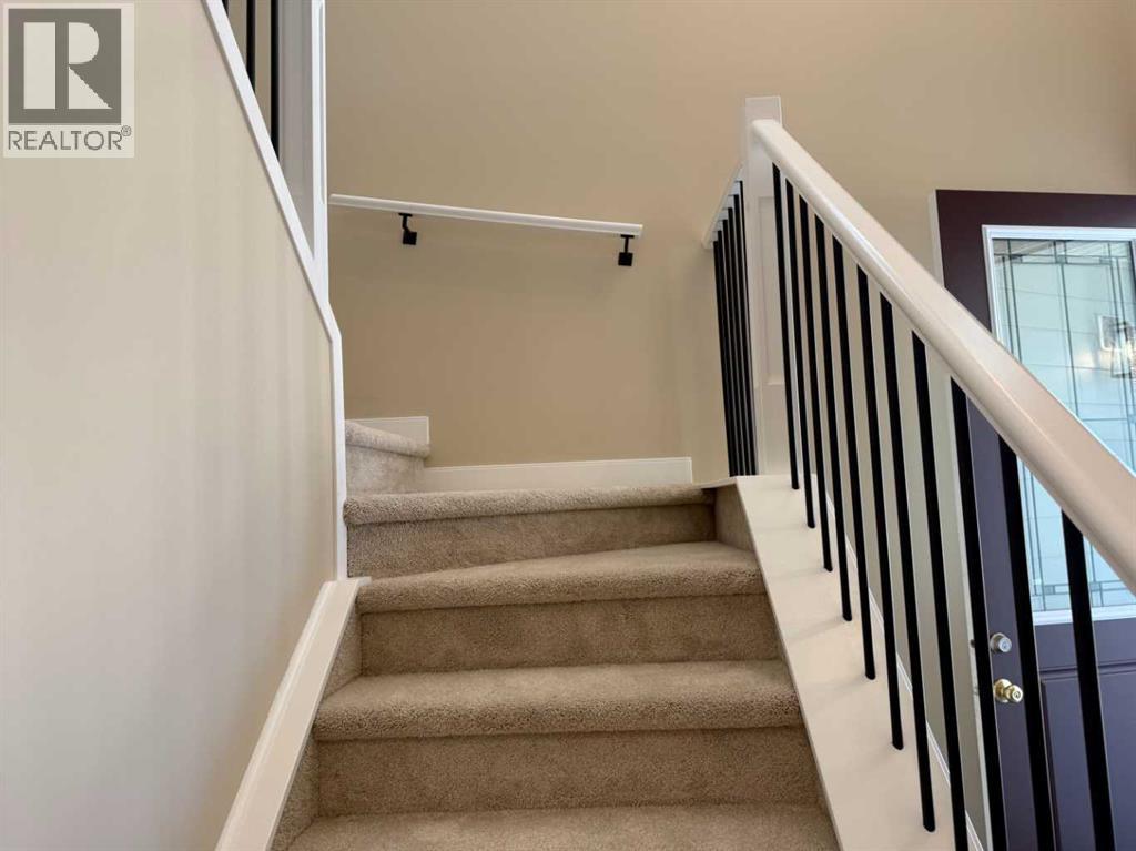 91 Sundown Crescent, Cochrane, Alberta  T4C 1Y3 - Photo 21 - A2228402