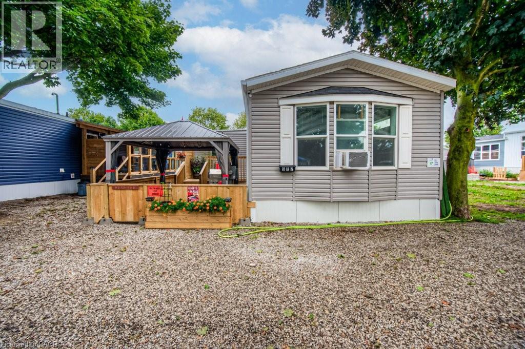 FISHING IN YOUR OWN BACKYARD! 4 Bedrooms = Great VALUE!! Discover your own little slice of paradise with year-round living at Twin Springs Cottage Condo Community. This peaceful retreat offers the perfect balance of relaxation, recreation, and comfort. This charming modular home has been thoughtfully expanded with a spacious addition, featuring 4 bedrooms and a full bathroom—perfect for hosting family, friends, or guests. With fantastic Airbnb potential, it’s an excellent opportunity for investors or anyone looking for a flexible getaway property. Set on an extra-wide lot (approx. 35 x 75 ft), there’s plenty of outdoor space to unwind. The fully fenced yard includes a brand-new shed, beautifully lit gazebo, propane BBQ hookup, and a wooden deck—ideal for entertaining or soaking up the sunshine during summer gatherings. Surrounded by nature, this home offers a rare mix of year-round comfort and cottage-style charm, making it equally suited as a full-time residence or weekend escape. Residents of Twin Springs enjoy access to two lakes and a beach area—perfect for kayaking, canoeing, fishing, or simply relaxing by the water. Community amenities include volleyball, horseshoes, ping pong, a playground, and a community centre, offering plenty of ways to connect and unwind. Despite its tranquil, rural feel, Twin Springs is conveniently located just a short drive from Woodstock, Brantford, Paris, and major highways, making it easy to reach from anywhere. Whether you’re looking to downsize, invest, or embrace a simpler, more peaceful lifestyle, this home delivers the perfect blend of relaxation, recreation, and convenience. Your year-round escape awaits—bring your fishing rod and start living the good life! (id:48254)