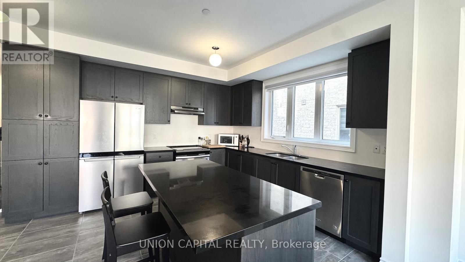 63 Erintol Way, Markham, Ontario  L3S 0E7 - Photo 5 - N12573148