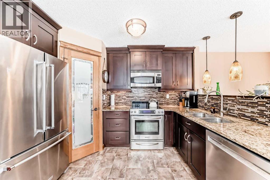 203 Hidden Spring Green Nw, Calgary, Alberta  T3A 5N4 - Photo 6 - A2272070