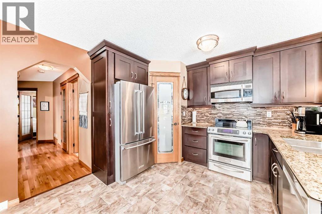 203 Hidden Spring Green Nw, Calgary, Alberta  T3A 5N4 - Photo 5 - A2272070