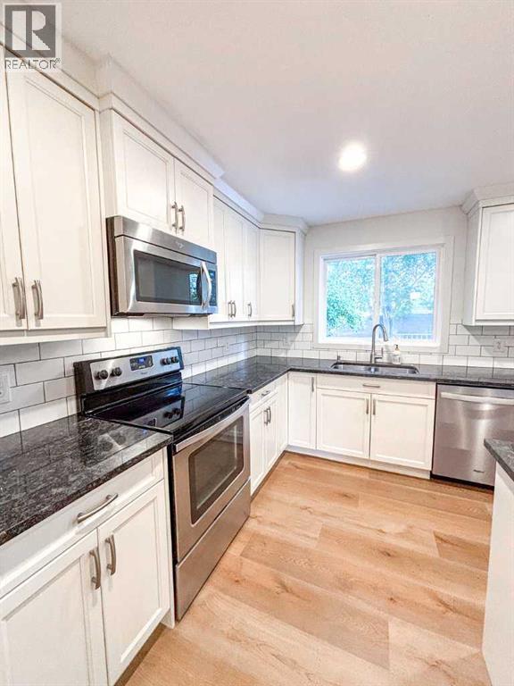 12 Oakbury Place Sw, Calgary, Alberta  T2V 4A2 - Photo 7 - A2250378