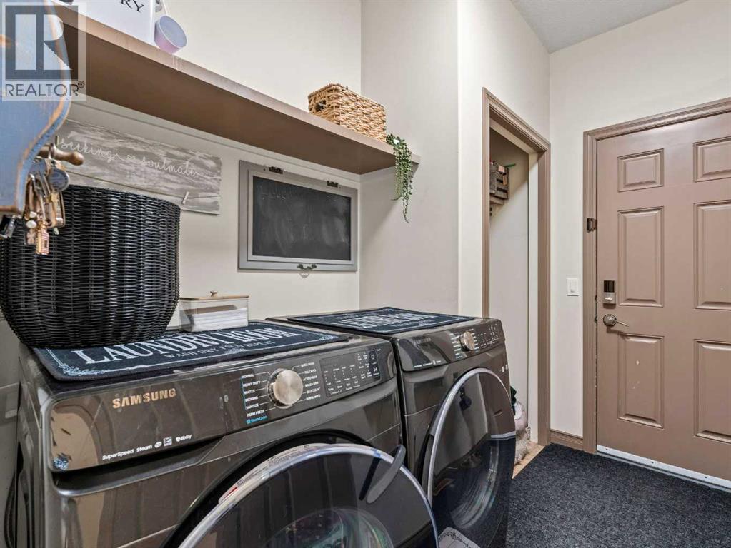 95 Crystal Shores Road, Okotoks, Alberta  T1S 2H9 - Photo 13 - A2272491