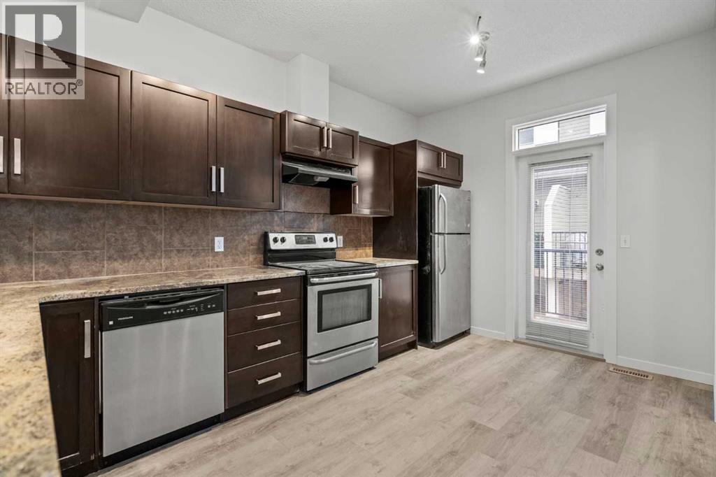 39 New Brighton Point Se, Calgary, Alberta  T2Z 1B8 - Photo 4 - A2271073