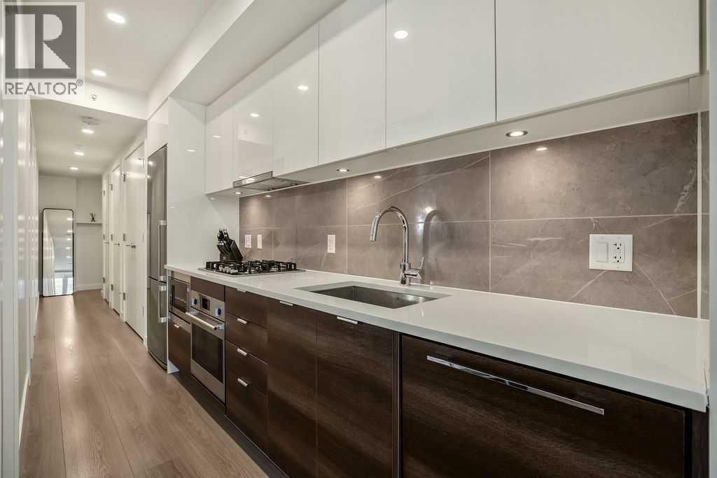 103, 108 Waterfront Court Sw, Calgary, Alberta  T2P 1K7 - Photo 3 - A2267231