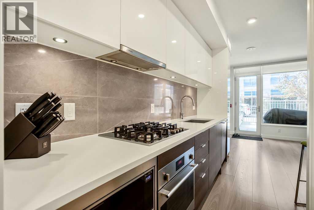 103, 108 Waterfront Court Sw, Calgary, Alberta  T2P 1K7 - Photo 2 - A2267231