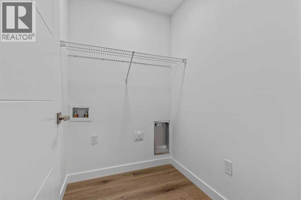 90 Heritage Circle, Cochrane, Alberta  T4C 3G9 - Photo 36 - A2267772