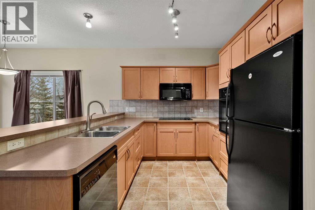 116 Tucker Circle, Okotoks, Alberta T1S 2J8 - Photo 6 - A2271009