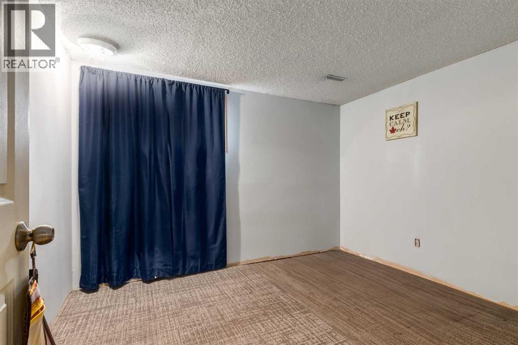 7711 Bowcliffe Crescent Nw, Calgary, Alberta  T3B 2S5 - Photo 19 - A2260325