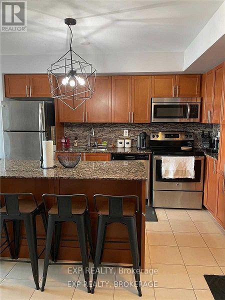 702 - 830 Lawrence Avenue E, Toronto, Ontario  M6A 3C6 - Photo 4 - W12588348