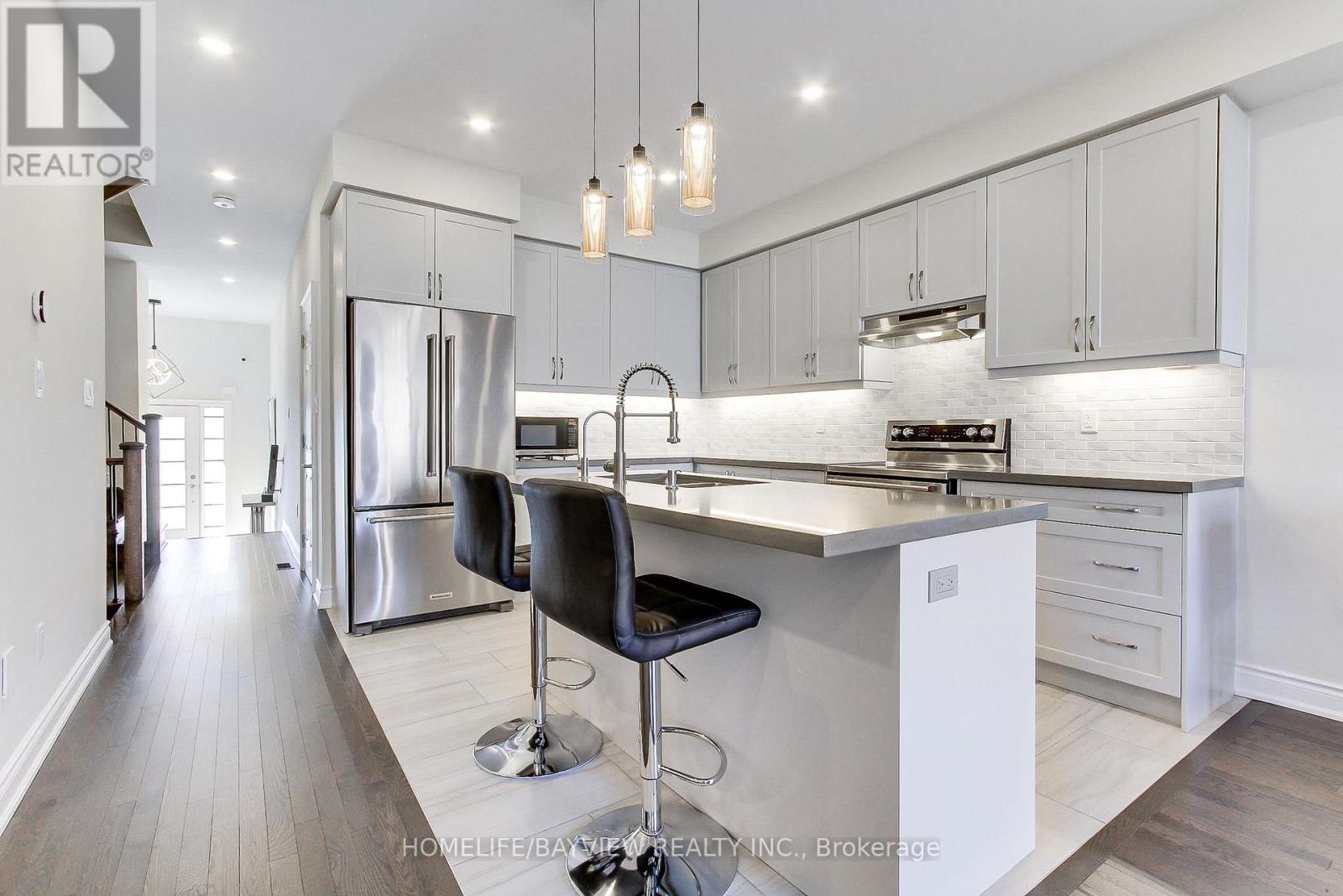 70 Lorne Thomas Place, New Tecumseth, Ontario  L9R 0V8 - Photo 5 - N12471089