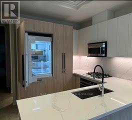 209 - 123 Maurice Drive, Oakville, Ontario  L6K 2W6 - Photo 4 - W12589966