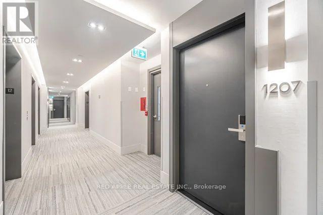 1207 - 18 Water Walk Drive, Markham, Ontario  L3R 6L5 - Photo 4 - N12592146