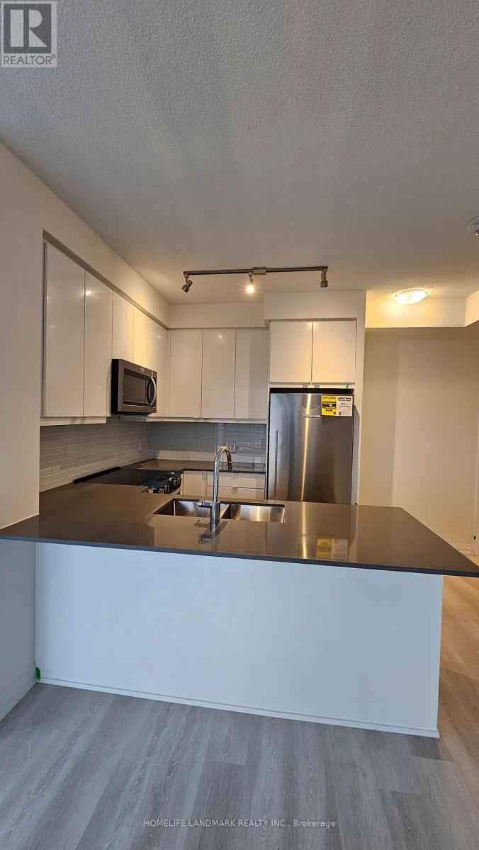 1302 - 3260 Sheppard Avenue E, Toronto, Ontario  M1T 3K3 - Photo 4 - E12594480