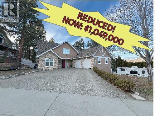 Welcome to this spacious 3-storey home in a quiet Sahali neighborhood. This home is perfect for growing or multi-generational families. The bright and airy great room with cozy gas fireplace, features engineered hardwood throughout and opens to a covered deck with gas quick-connect for BBQ, perfect for entertaining. The large kitchen boasts loads of counter and cupboard space, plus stone countertops & gas stove (2024) . A convenient main floor laundry leads to the oversized 22'11"" x 25'2"" garage with an EV charger. There's ample parking, including RV parking with a 30-amp plug-in. The main floor also includes a primary bedroom with a 4-piece ensuite (heated tile floors), double closets, and French doors leading to a patio with a hot tub-ready outlet. An additional 2-piece bathroom is located on the main floor. Downstairs, you'll find a beautifully finished walkout in-law suite with a separate entry & modern kitchen, a games room, den, and a spacious bedroom. The large room under the suspended garage slab offers endless possibilities. Enjoy a private, fenced yard with irrigation just minutes from schools, shopping, transportation, and hiking trails. Quick possession is available. (id:48254)