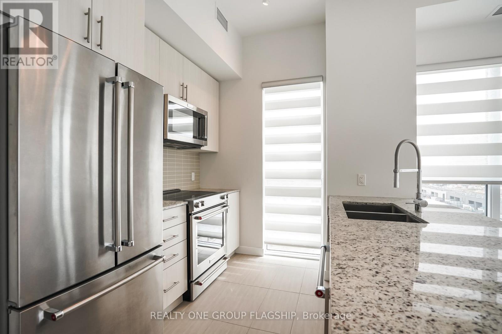 725 - 4055 Parkside Village Drive, Mississauga, Ontario  L5B 0K8 - Photo 4 - W12461740