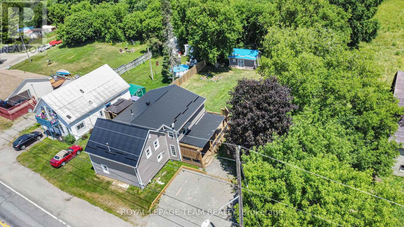 Welcome to this beautifully maintained two-storey home offering over 2,400 square feet of spacious and comfortable living that has been thoughtfully designed for family life. The bright and inviting living room offers seamless access to a large private back deck, making it the perfect spot for outdoor dining, entertaining, or simply relaxing in the sun. A charming side porch also leads directly to the deck, adding to the home's functionality and outdoor appeal. The large eat-in kitchen provides plenty of counter space and storage, making meal prep and family gatherings a breeze. A convenient main floor powder room provides ample space for a growing family or guests. Upstairs, you'll find four bedrooms , including a generously sized primary with luxurious five-piece ensuite, as well as a full bathroom and conveniently located laundry area--no more hauling baskets up and down the stairs. Step outside to enjoy the peace and privacy of a fully fenced backyard with no rear neighbours. This expansive outdoor space is perfect for kids, pets, or simply enjoying quiet evenings under the stars. Important updates have already been taken care of, including a new furnace installed in 2019, central air conditioning added in 2021, and a durable metal roof in 2019.This home combines space, privacy, and practicality in a lovely rural setting, just 15 mins from all the amenities of Smiths Falls. Sellers are motivated. (id:48254)