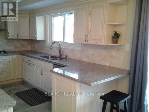 Main & Upper - 40 St Andrews Boulevard, Toronto, Ontario  M9R 1W1 - Photo 11 - W12597622