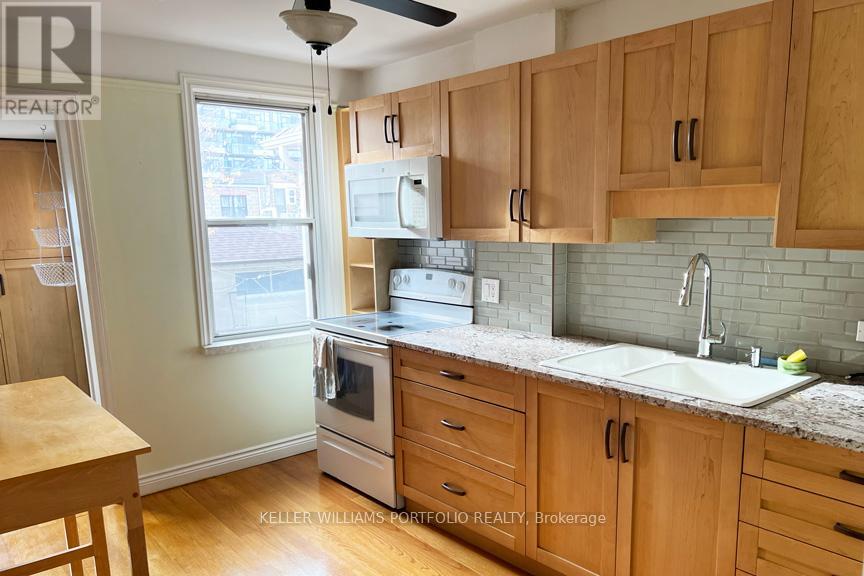 97 Livingstone Avenue, Toronto, Ontario  M6E 2L7 - Photo 5 - W12598660