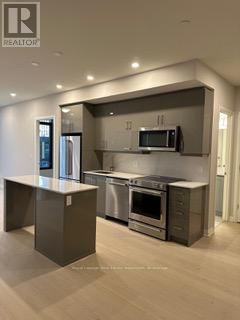 603 - 1415 Dundas Street E, Oakville, Ontario  L6H 8A3 - Photo 4 - W12600466