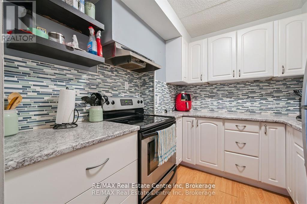 310 - 65 Silvercreek Parkway N, Guelph, Ontario  N1H 7R9 - Photo 1 - X12600856