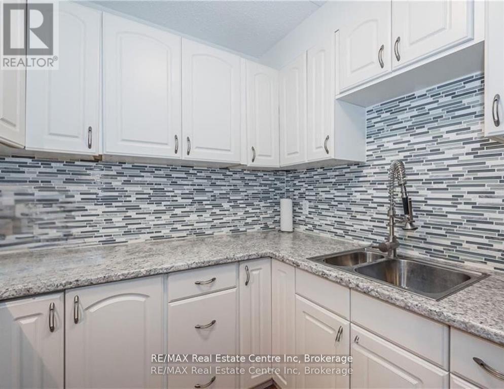 310 - 65 Silvercreek Parkway N, Guelph, Ontario  N1H 7R9 - Photo 2 - X12600856