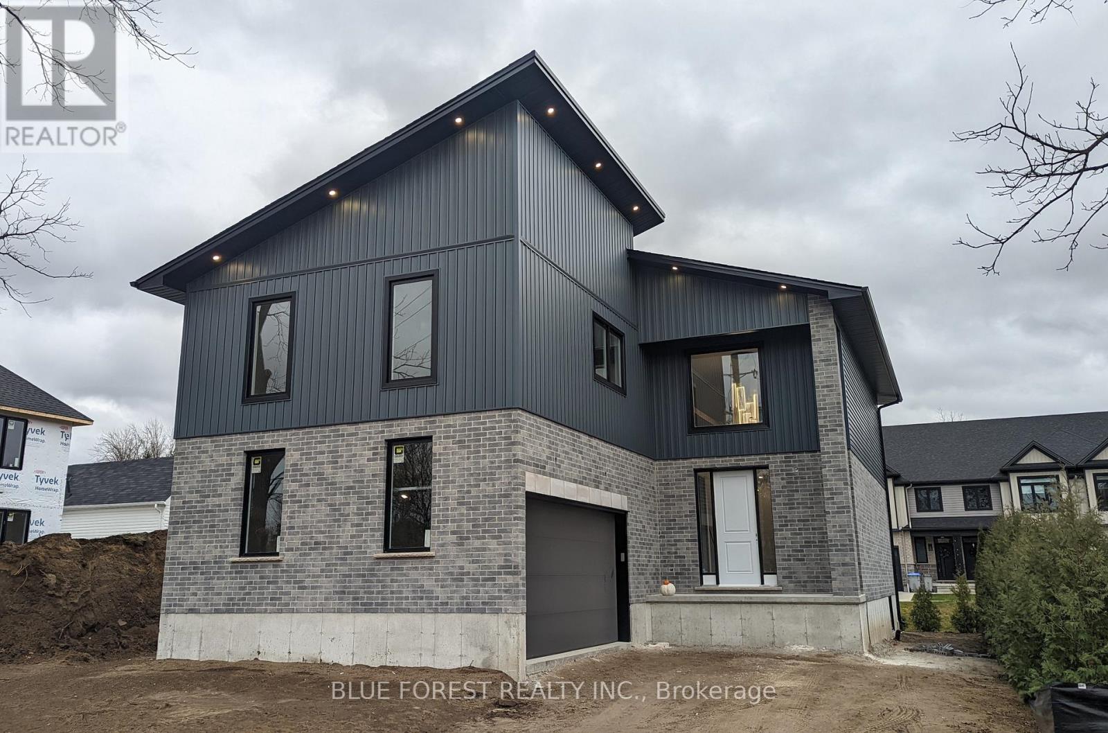 Currently being built and ready for early January! Welcome home to 619 Lions Park Dr. Bright and spacious open concept layout from the foyer to greet your guests to the rear great room to entertain them! The chef-inspired kitchen showcases premium custom cabinetry, quartz countertops, ample countertop and cabinet space, soft closing, and a 4 seater breakfast bar island. Main floor office is perfect for those that work from home. Upstairs you will find 4 bedrooms; the master bedroom is enormous and has a huge walk-in closet with natural lighting, and an ensuite with a walk-in glass shower and freestanding tub to relax in. Convenient second floor laundry. Separate second entrance to the basement - IN LAW SUITE! The unfinished basement was designed with a basement 2 bedroom apartment in mind and has bathroom and kitchen rough-ins installed. Outside, the long driveway leads up to the oversized two car garage. Many upgrades throughout including potlights galore, 8 foot doors, engineered hardwood flooring and ceramic tiles (no carpet here) and more. Steps away from Caradoc Community Centre and Tri-Township Arena. Enjoy a walk through the nearby Lion's Park trail, or jump in the car for a short drive to HWY 402, London, Strathroy and community amenities. (id:48254)