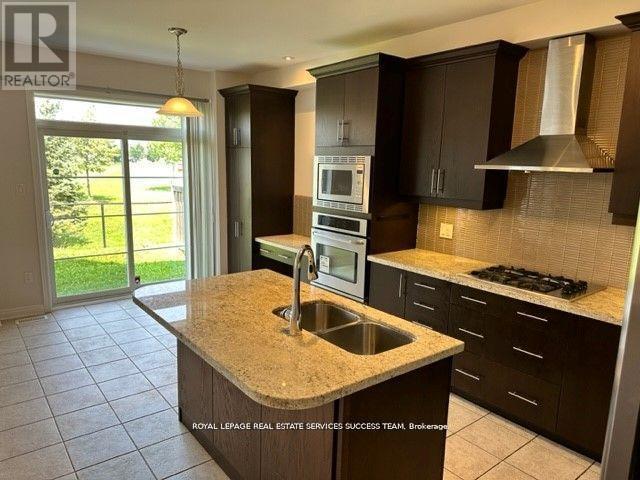 81 Kaitting Trail, Oakville, Ontario  L6M 0T6 - Photo 2 - W12603312