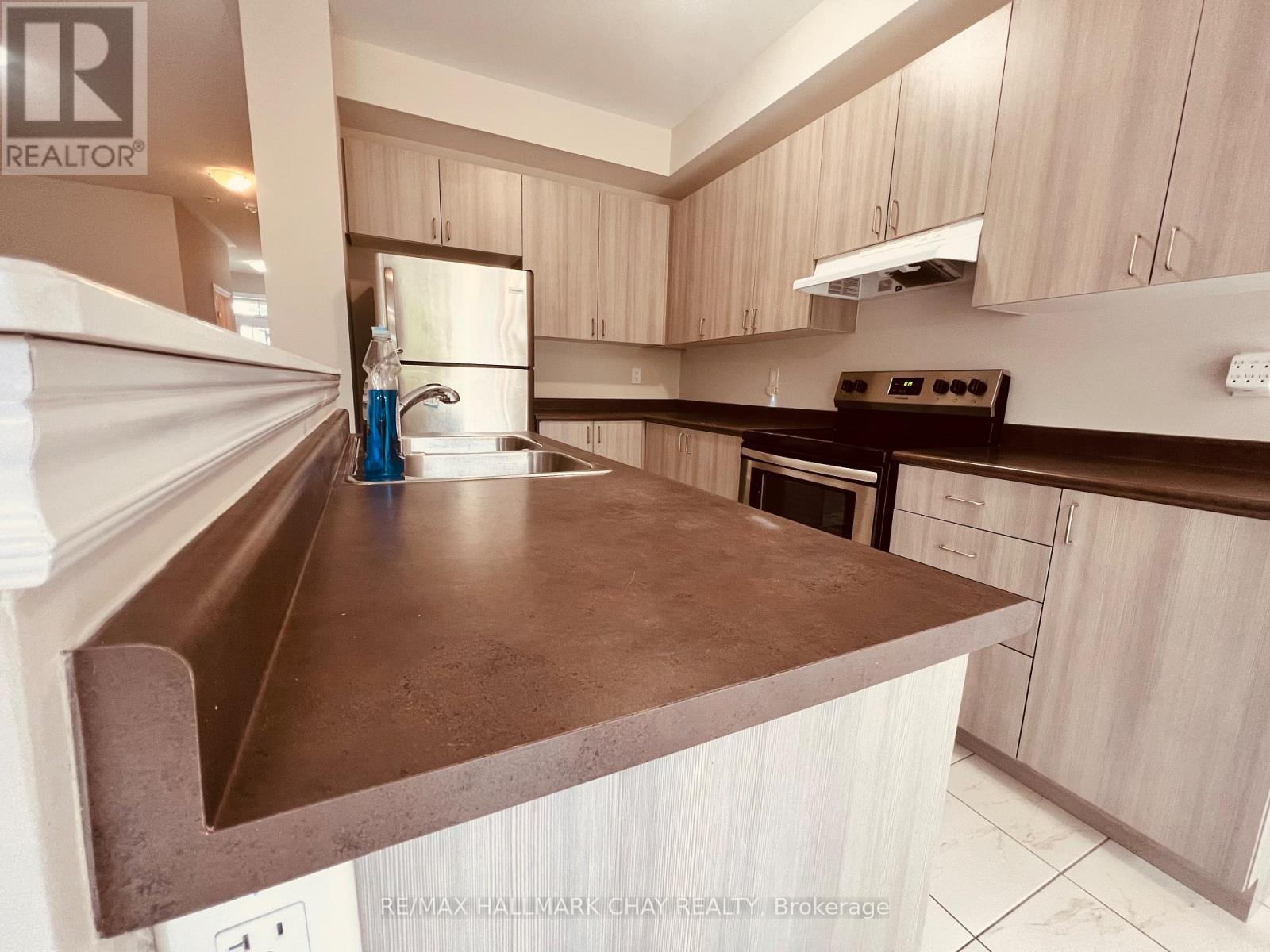 63 Greenwood Drive, Essa (Angus), Ontario  L0M 1B4 - Photo 5 - N12605480