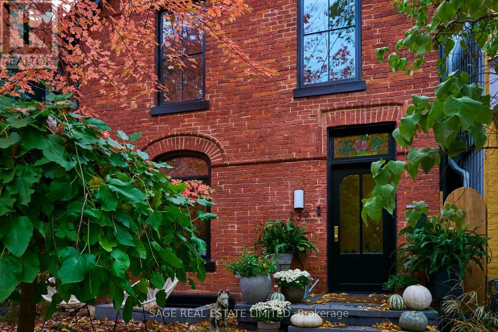 THE BOLD AND THE BORDEN. Absolute heart-stopper in the Annex with every single thing you thought of and things you hadn't even considered needing until this very second (keep reading). Designed by interior designer and homeowner, Lyndsay Jacobs Interior, this home is a gorgeous collision of design, function, soul and craftsmanship. Standout features include: meticulously restored 1878 stained glass windows, Canadian limestone fireplace mantle with gas insert, exposed brick, custom millwork throughout and soft curved walls that gently guide you through the space. Natural light pours in from 10-foot bi-fold kitchen windows/doors highlighting abundant custom cabinetry and a 17-foot floating Nero Borghini marble shelf. Built-in column fridge/freezer set up keeps things sleek, with under-counter refrigeration and prep sink offering daily luxury and professional level functionality. Skylights draw your eyes up through a four storey staircase by Ultrastairs, leading to serene, peaceful bedroom quarters where the outside world disappears and offers you a deep exhale from the chaotic energy of the day. Bathrooms feature unlacquered brass plumbing fixtures from Watermark, Waterworks and Kallista. And then there's the rooftop: a private, treetop-view sanctuary with a saltwater Arctic Spa hot tub, beverage station, natural gas fire pit hookup and pure Toronto magic in all four seasons.The lower level includes a custom media room designed by Bay Bloor Radio, with in-wall Bowers & Wilkins surround sound. Other lower level features include a 400-bottle, climate controlled wine cellar, a dog wash and a fully contained in-law suite. Perilously perfect location sandwiched between the fab restaurant scenes on Harbord and in Yorkville and a quick skip to Ossington. Boldly go to Borden. A winner in every single way. (id:48254)