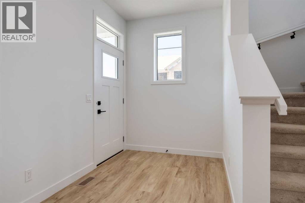 39 Belgian Court, Cochrane, Alberta  T4C 3H5 - Photo 7 - A2264575