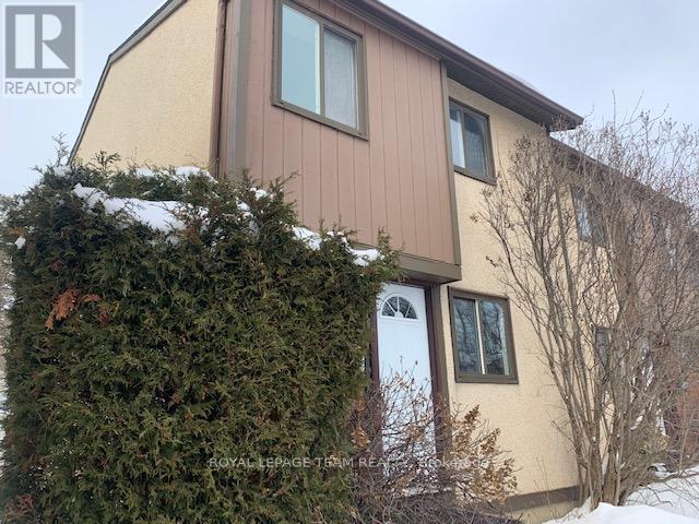 E - 14 Larkshire Lane, Ottawa, Ontario  K2J 1Y6 - Photo 2 - X12608822