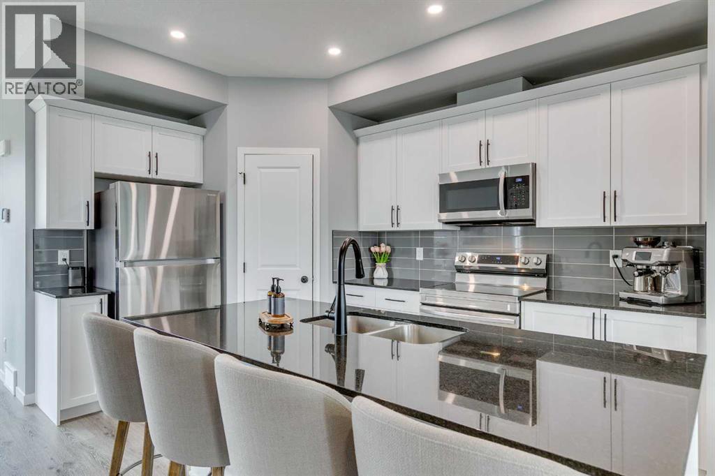 63 Wolf Gate, Okotoks, Alberta  T1S 5T9 - Photo 6 - A2272777