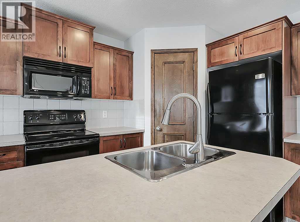 409 Cimarron Boulevard, Okotoks, Alberta  T1S 0A9 - Photo 7 - A2269381