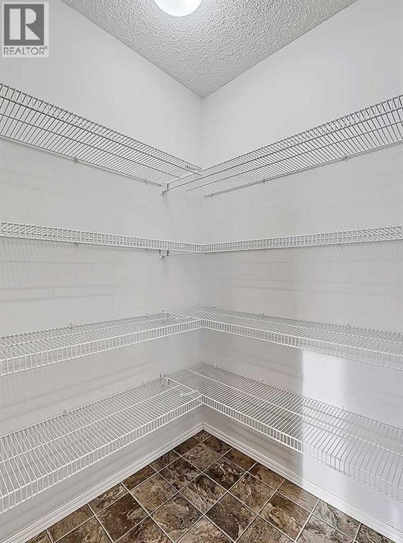 409 Cimarron Boulevard, Okotoks, Alberta  T1S 0A9 - Photo 10 - A2269381