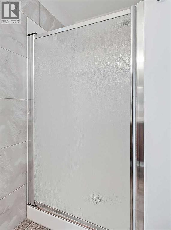 409 Cimarron Boulevard, Okotoks, Alberta  T1S 0A9 - Photo 19 - A2269381