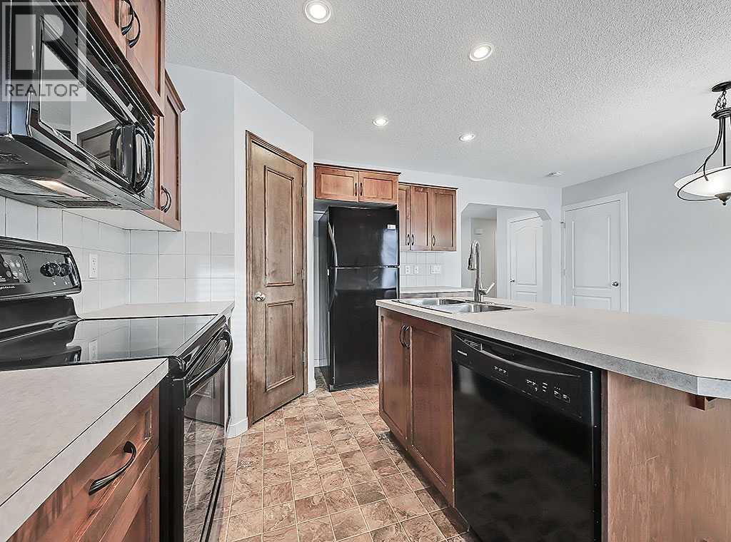 409 Cimarron Boulevard, Okotoks, Alberta  T1S 0A9 - Photo 8 - A2269381