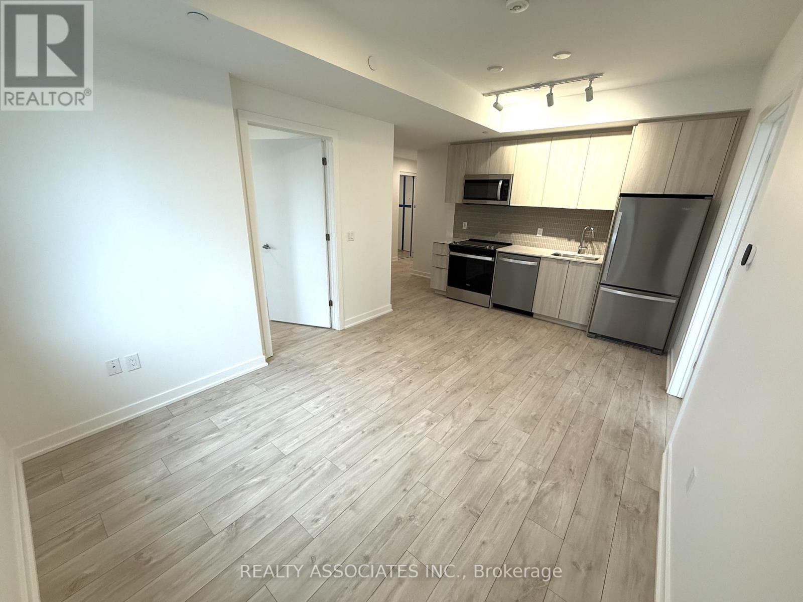 203 - 720 Whitlock Avenue, Milton, Ontario L9E 2B5 - Photo 3 - W12614542