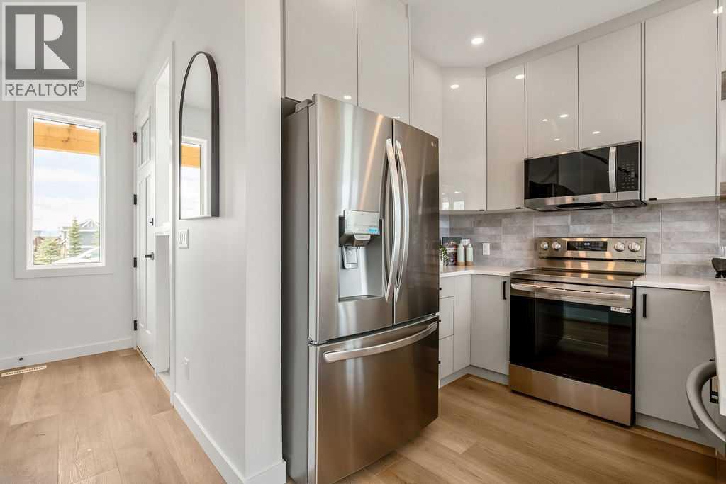 642 Cottageclub Bend, Rural Rocky View County, Alberta  T4C 1B1 - Photo 3 - A2271724