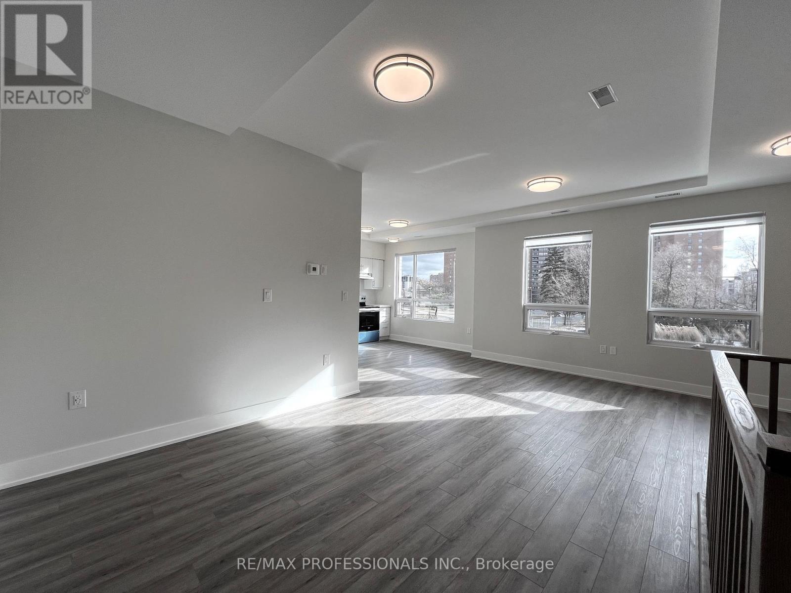 123 - 62 Dixfield Drive, Toronto, Ontario  M9C 3W1 - Photo 4 - W12614750