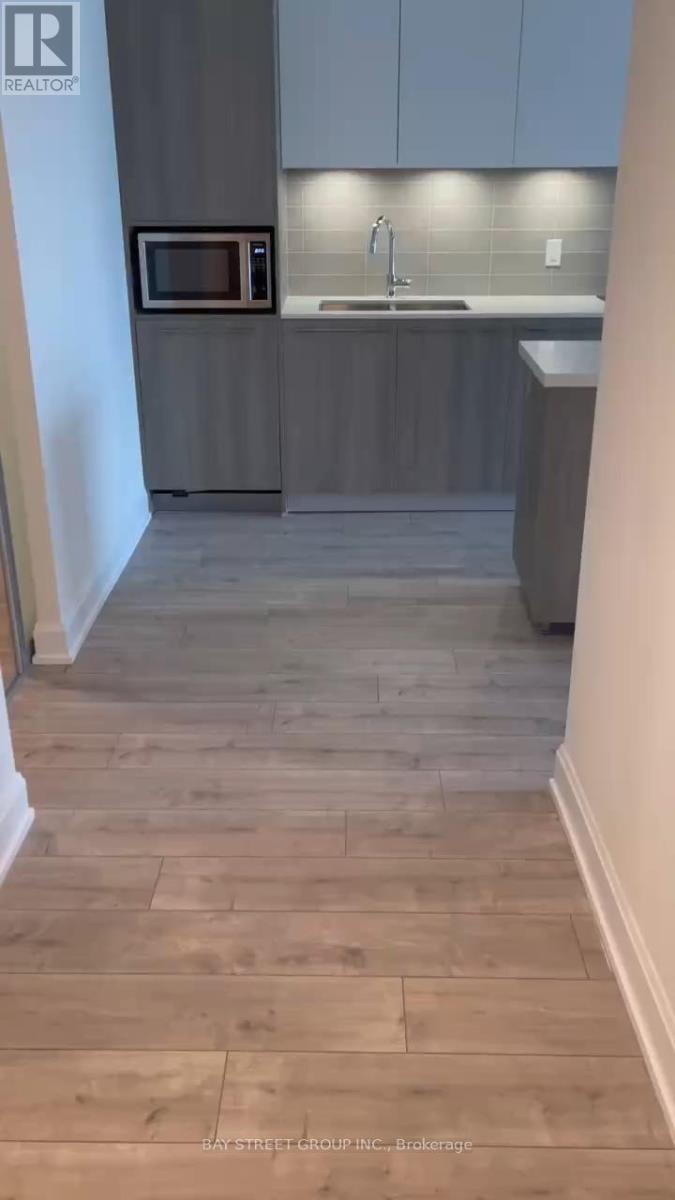 709 - 38 Water Walk Drive, Markham, Ontario  L3R 6M8 - Photo 2 - N12621444