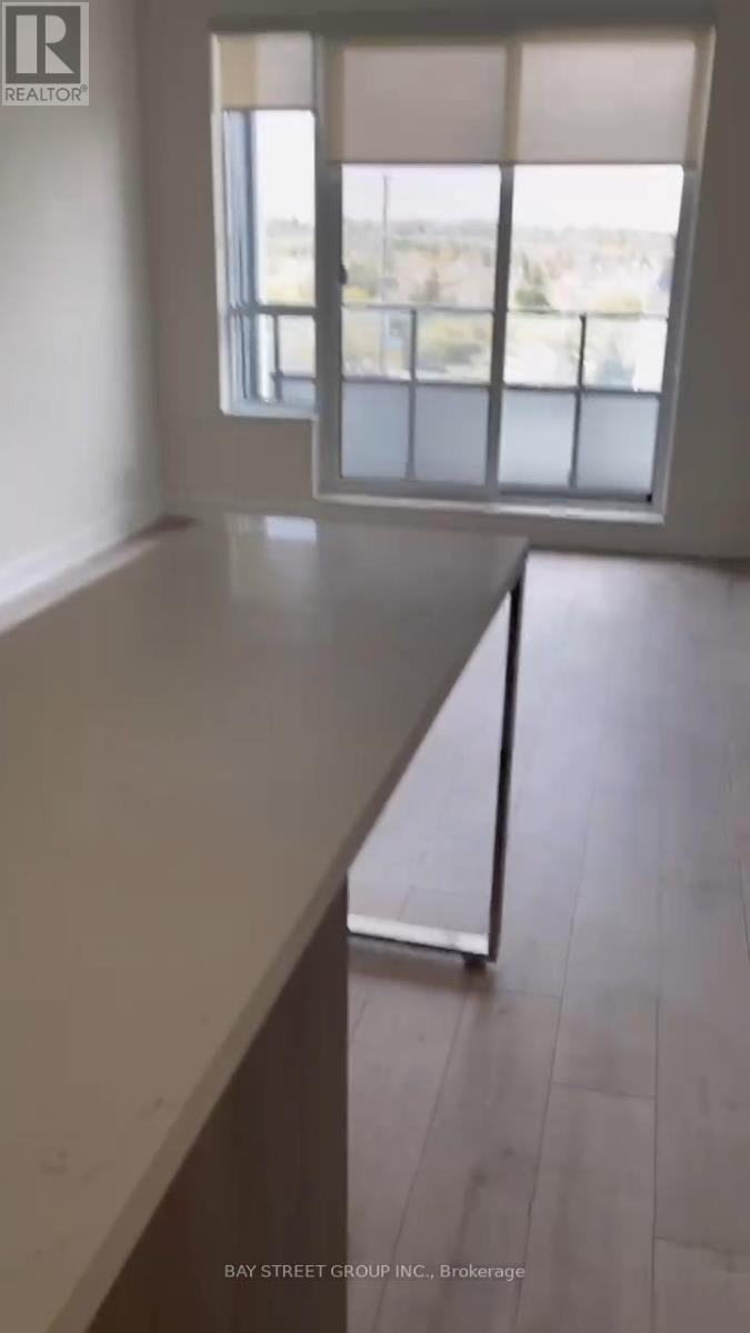 709 - 38 Water Walk Drive, Markham, Ontario  L3R 6M8 - Photo 4 - N12621444